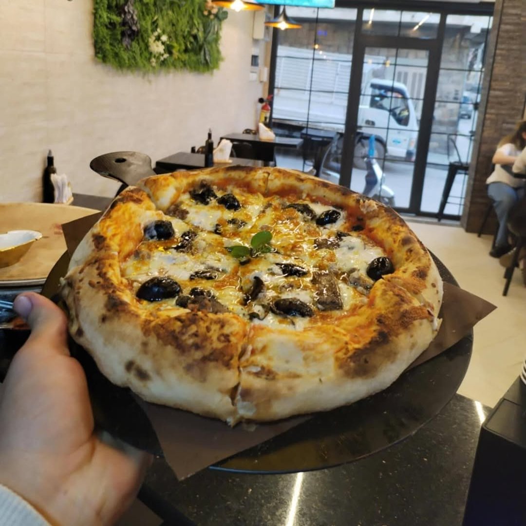 Pizza cuite au four chez Pizza One